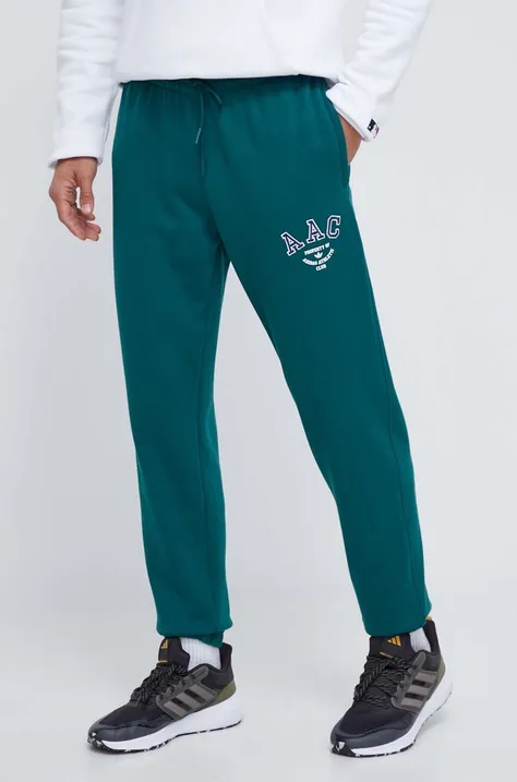 Памучен спортен панталон adidas Originals в зелено с апликация