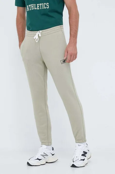 New Balance spodnie dresowe kolor zielony gładkie