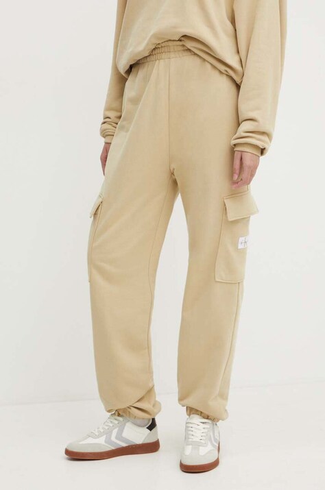 Хлопковые спортивные штаны Calvin Klein Jeans цвет бежевый однотонные J20J223589