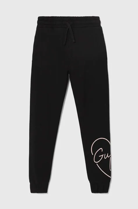 Детски памучен спортен панталон Guess в черно с апликация J4YQ16 KA6R3
