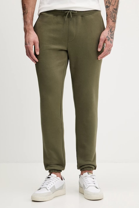 Tommy Jeans spodnie dresowe kolor zielony gładkie DM0DM20473