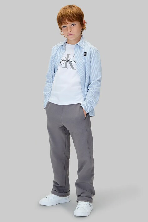 Детские хлопковые брюки Calvin Klein Jeans цвет серый однотонные IB0IB02571