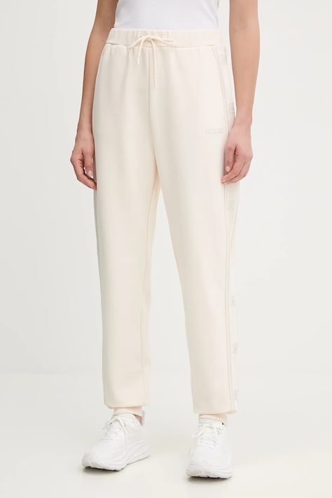 Tepláky Guess OCTAVIA dámské, béžová barva, s aplikací, V5BB23 KCX22
