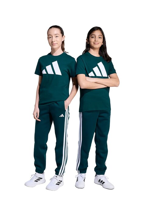 Otroški spodnji del trenirke adidas zelena barva, JW3406