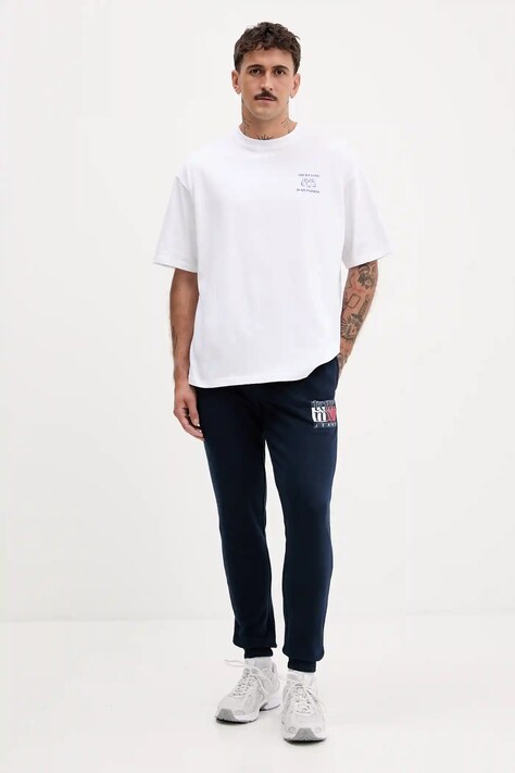 Bombažen spodnji del trenirke Tommy Jeans moški, mornarsko modra barva, DM0DM22094