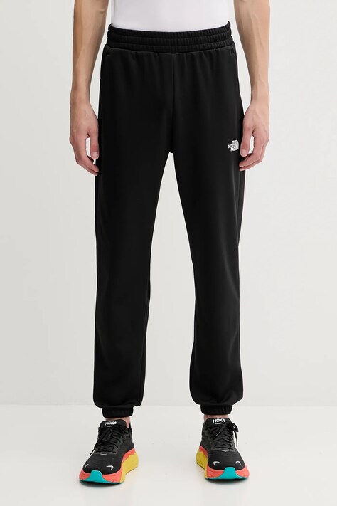 Tepláky The North Face Reaxion 2.0 pánské, černá barva, NF0A8DRSKS71