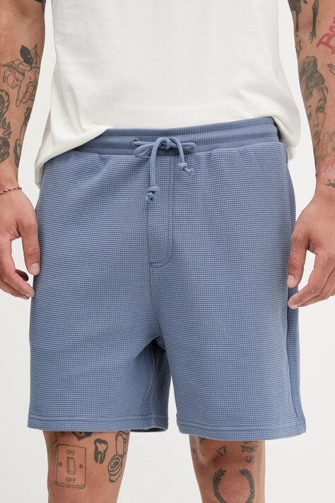 Bavlněné šortky Tommy Jeans pánské, modrá barva, DM0DM21805