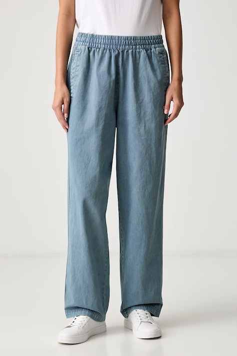 Puma jeansy relaxed fit damskie FUTURE PUMA ARCHIVE turkusowe 638361