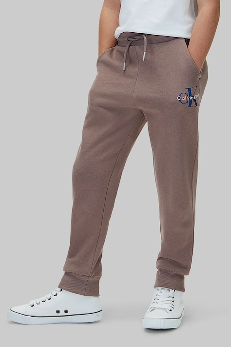Calvin Klein Jeans Spodnie dresowe dziecięce bawełniane brązowe regular waist LVCKTJC08U