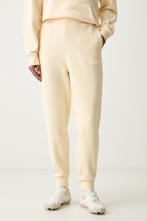 Puma spodnie dresowe damskie z bawełną Essentials żółte high waist 682457