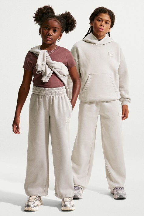 Nike Spodnie dresowe dziecięce z bawełną Nike Sportswear Club beżowe high waist IO1694