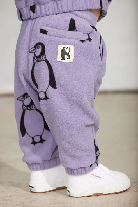 Mini Rodini spodnie joggery dziecięce polarowe Penguin fioletowe regular waist 11000365
