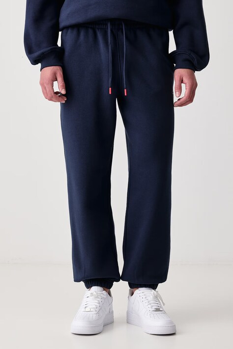 Jordan Spodnie dresowe męskie z bawełną Brooklyn Fleece granatowe regular waist IM8906.419