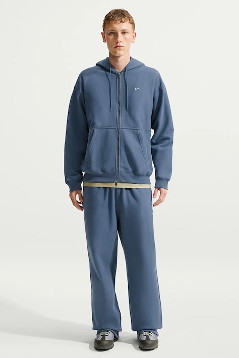 Nike Sportswear Spodnie dresowe męskie z bawełną Solo Swoosh niebieskie HV1090.491