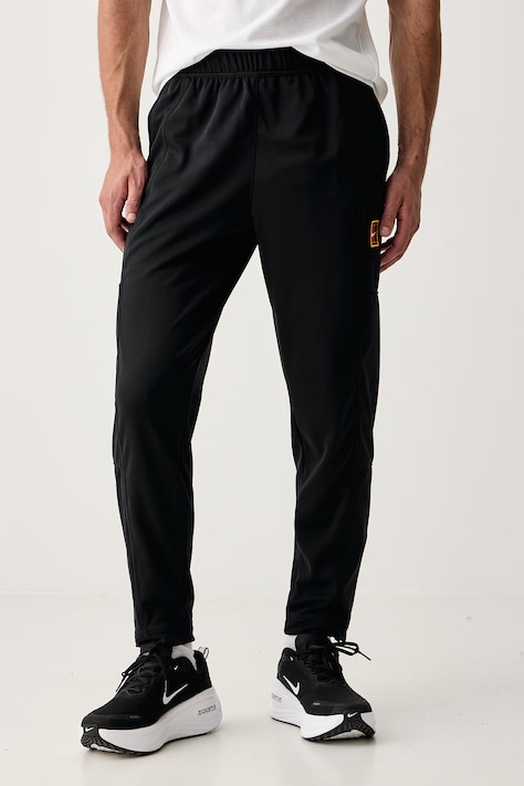 Nike Sportswear Spodnie treningowe damskie NikeCourt Heritage czarne regular waist FZ6928.010
