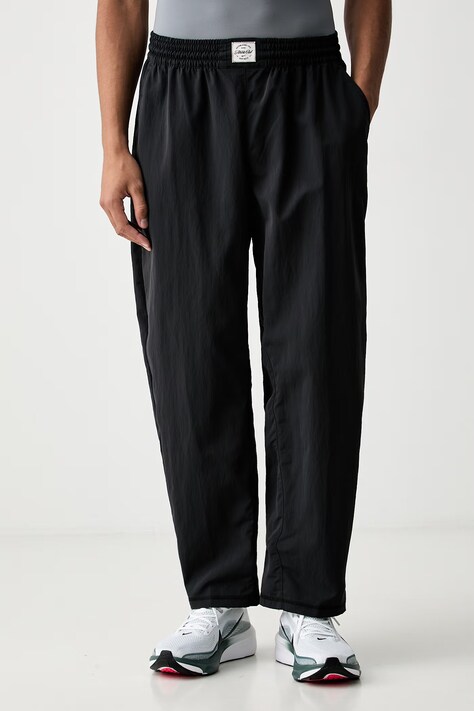 Nike spodnie treningowe męskie N.A.C. czarne regular waist IF2210.010