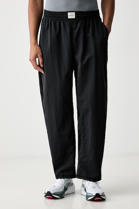 Nike spodnie treningowe męskie N.A.C. czarne regular waist IF2210.010