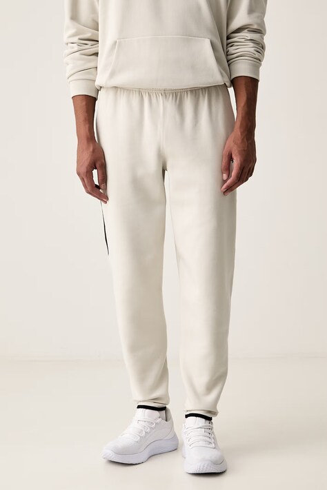 Under Armour Spodnie dresowe męskie Unstoppable beżowe regular waist 6013427