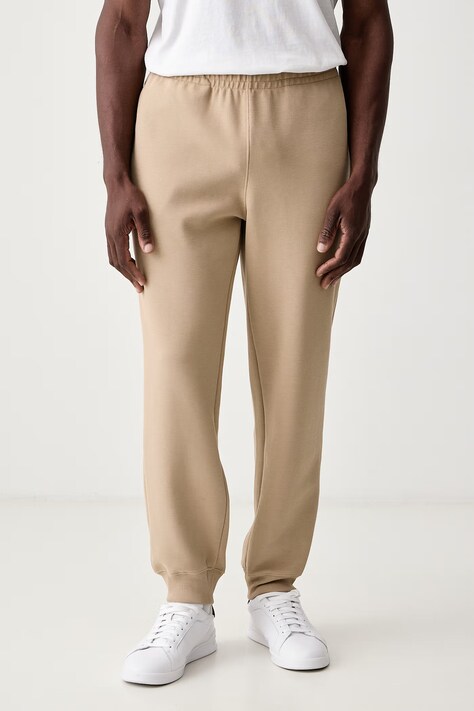Lacoste Spodnie dresowe męskie z bawełną beżowe regular waist XH9455