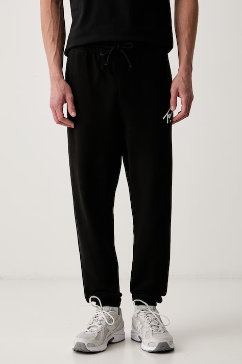 Tommy Jeans tepláky pánské bavlněné černé regular waist DM0DM23593