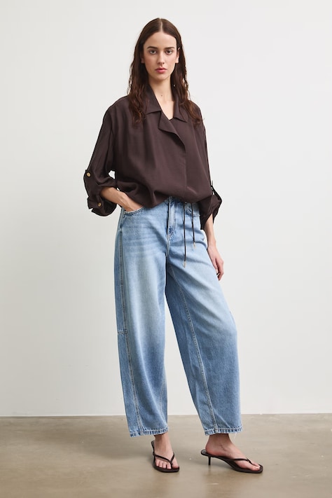 Jeansy slouchy damskie z efektem sprania niebieskie RS26-SJD901