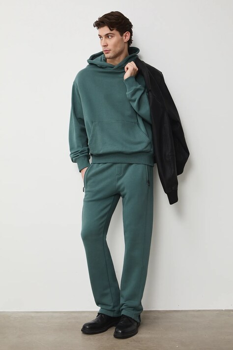 Medicine spodnie dresowe męskie bawełniane zielone regular waist