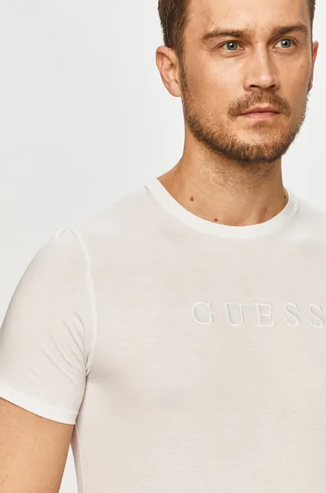 Памучна тениска Guess в бяло с апликация