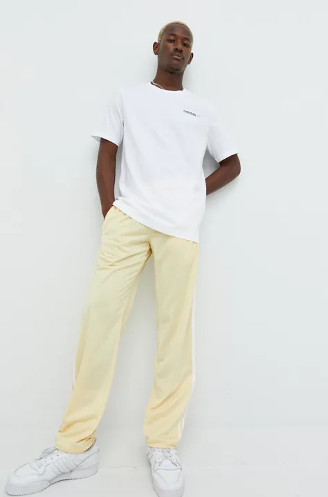 adidas Originals spodnie dresowe męskie kolor żółty gładkie