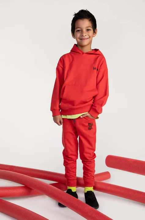 Otroška bombažna mikica Coccodrillo rdeča barva, s kapuco