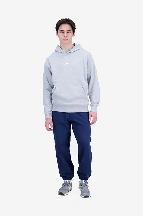 Bombažen pulover New Balance moška, siva barva, s kapuco