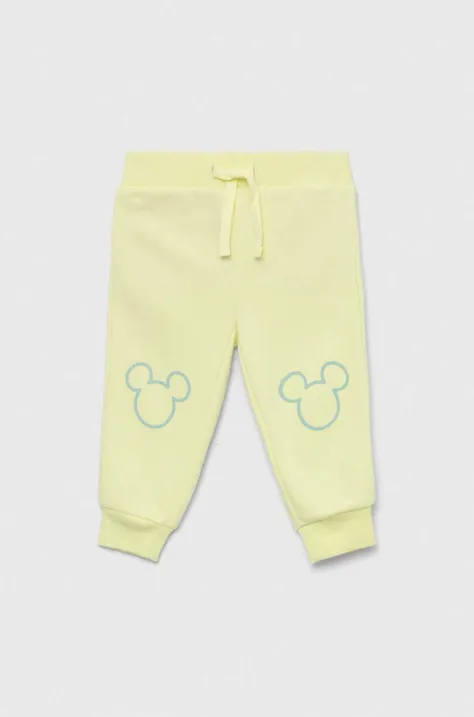 GAP spodnie dresowe dziecięce x Disney kolor żółty z nadrukiem