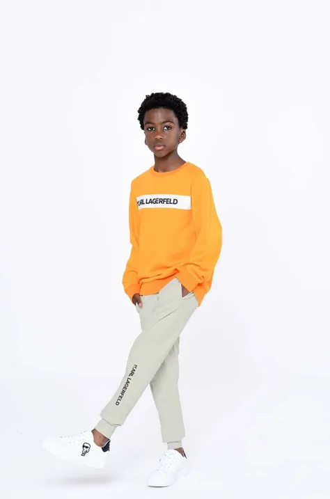 Детские спортивные штаны Karl Lagerfeld цвет бежевый с принтом