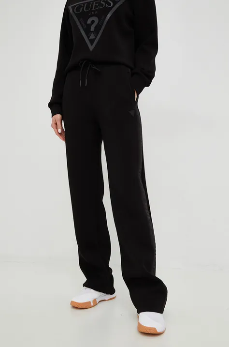 Спортивні штани Guess жіночі колір чорний з принтом