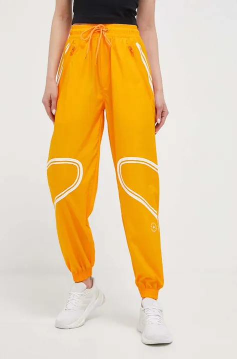 Hlače za vadbo adidas by Stella McCartney TruePace oranžna barva
