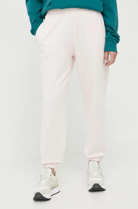 New Balance spodnie dresowe bawełniane kolor różowy gładkie