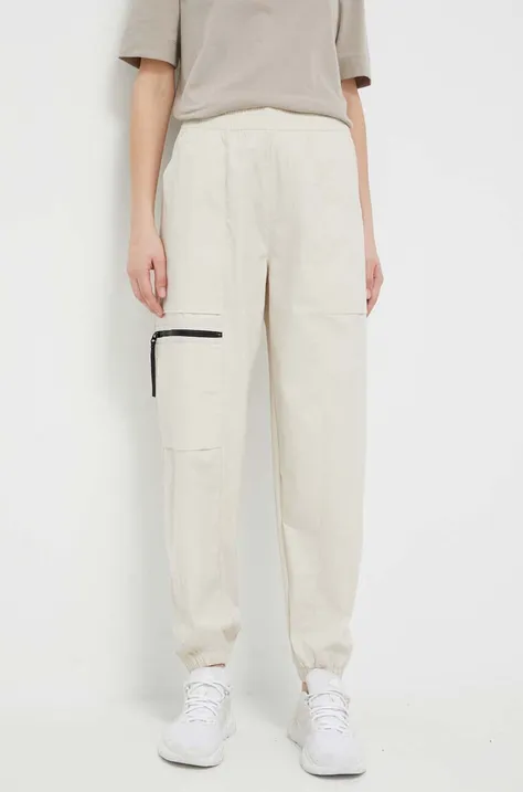Kalhoty New Balance dámské, béžová barva