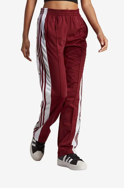 Спортен панталон adidas Originals в червено с апликация