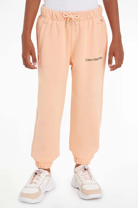 Calvin Klein Jeans pantaloni de trening pentru copii culoarea portocaliu, neted