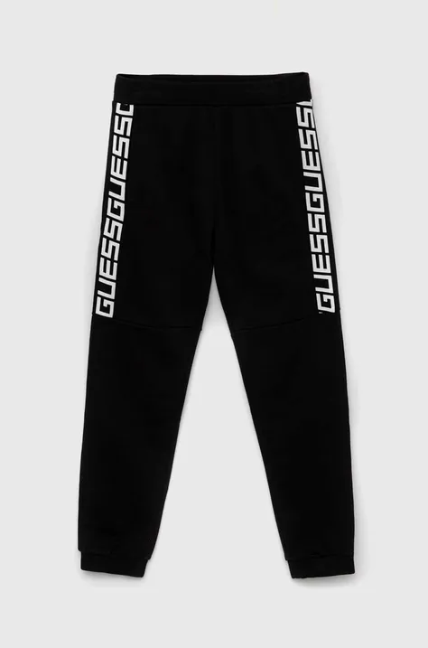 Guess pantaloni de trening din bumbac pentru copii culoarea negru, cu imprimeu