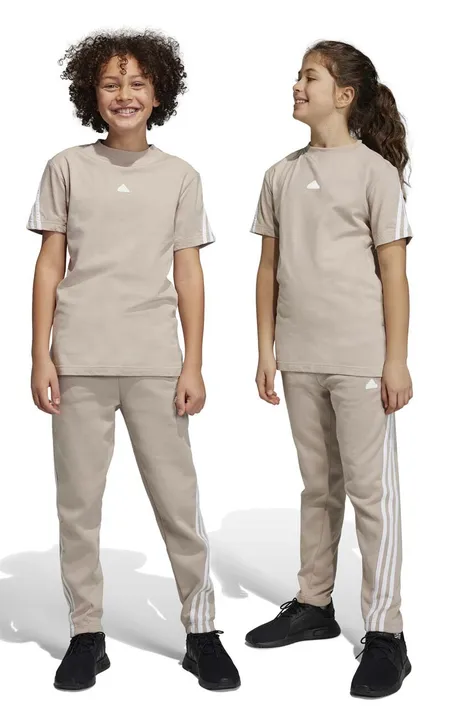 adidas spodnie dresowe dziecięce U FI 3S kolor beżowy z aplikacją