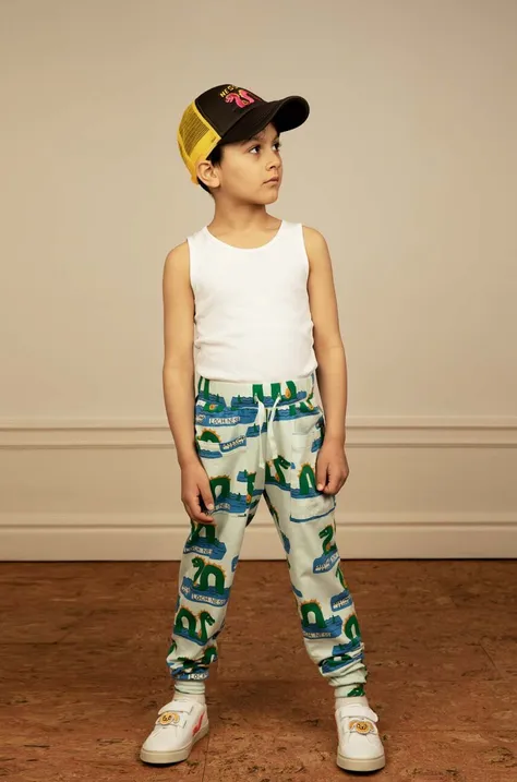 Детские спортивные штаны Mini Rodini цвет зелёный с узором