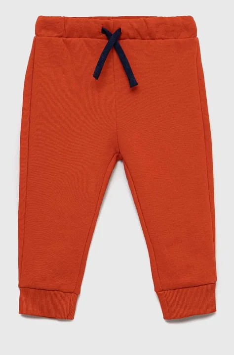 Детские хлопковые штаны United Colors of Benetton цвет красный однотонные