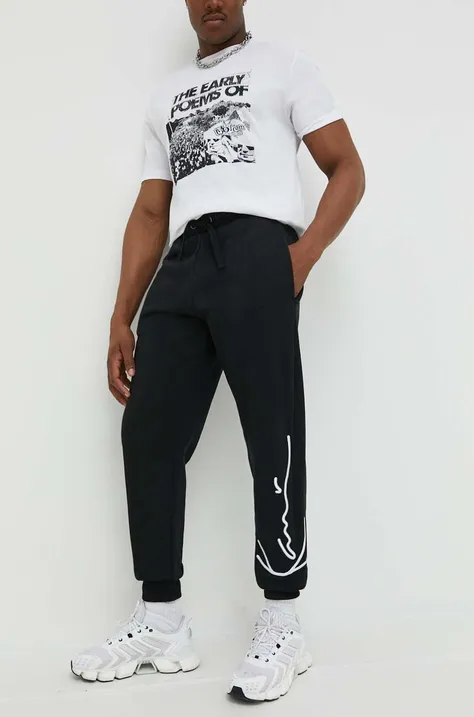 Спортен панталон Karl Kani в черно с апликация