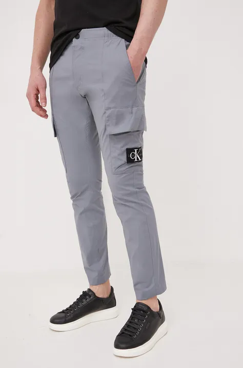 Nohavice Calvin Klein Jeans pánske, šedá farba, rovné