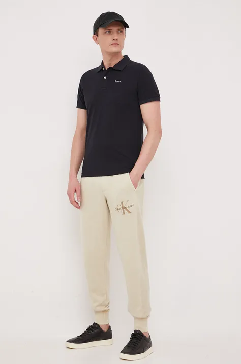 Calvin Klein Jeans pantaloni de trening din bumbac culoarea bej, neted