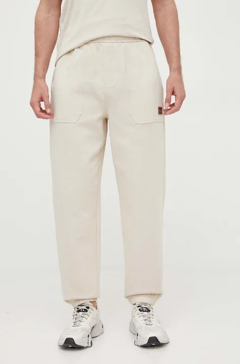 Calvin Klein Jeans spodnie dresowe bawełniane kolor beżowy gładkie