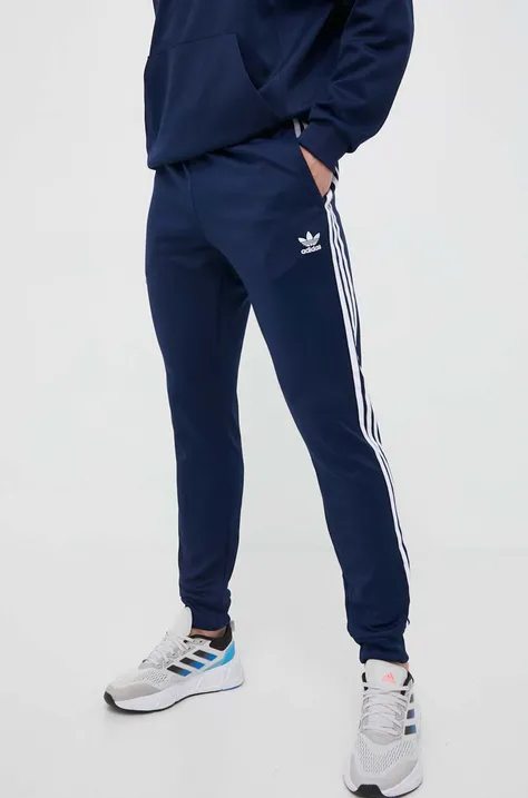 Spodnji del trenirke adidas Originals mornarsko modra barva