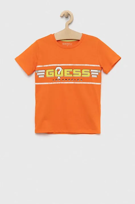Дитяча бавовняна футболка Guess колір помаранчевий з принтом