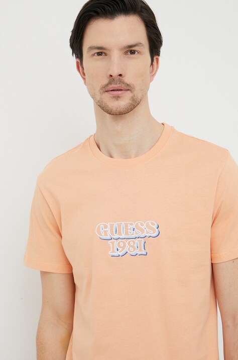 Памучна тениска Guess в оранжево с апликация