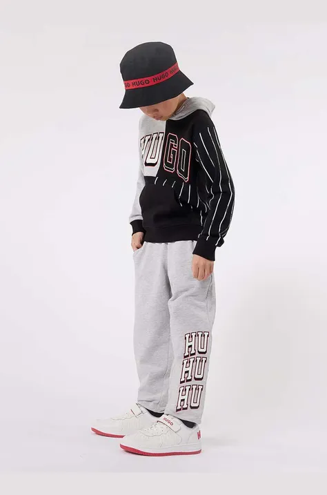 Дитячі спортивні штани HUGO колір сірий з принтом